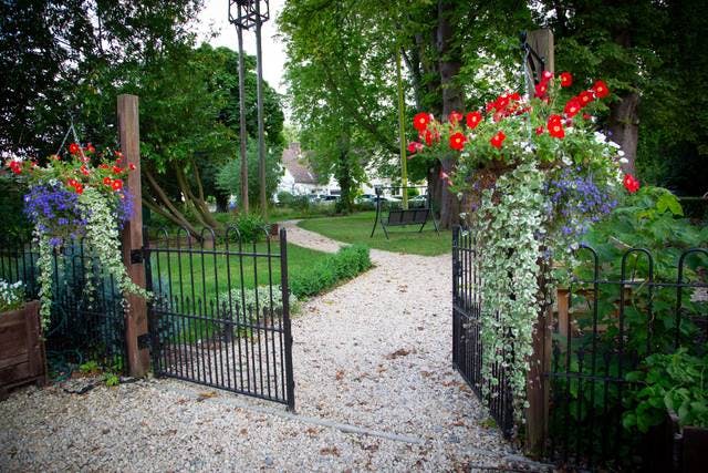 Charming garden entrance at Waddesdon Hall, perfect for outdoor events and ceremonies.