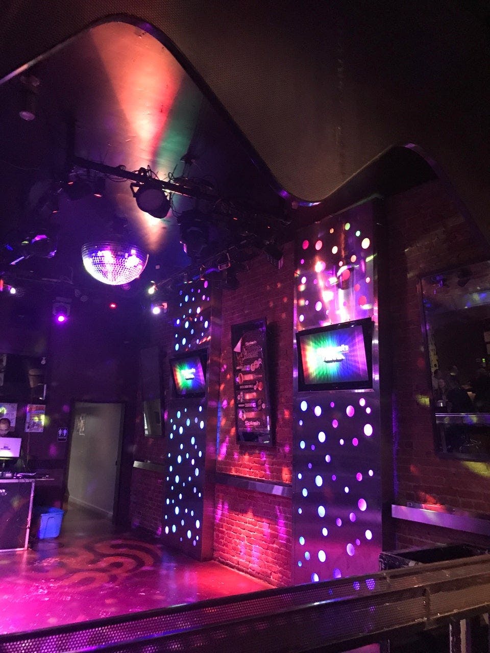 Vibrant dance floor with disco ball at Splash Bar San Jose for events and parties.