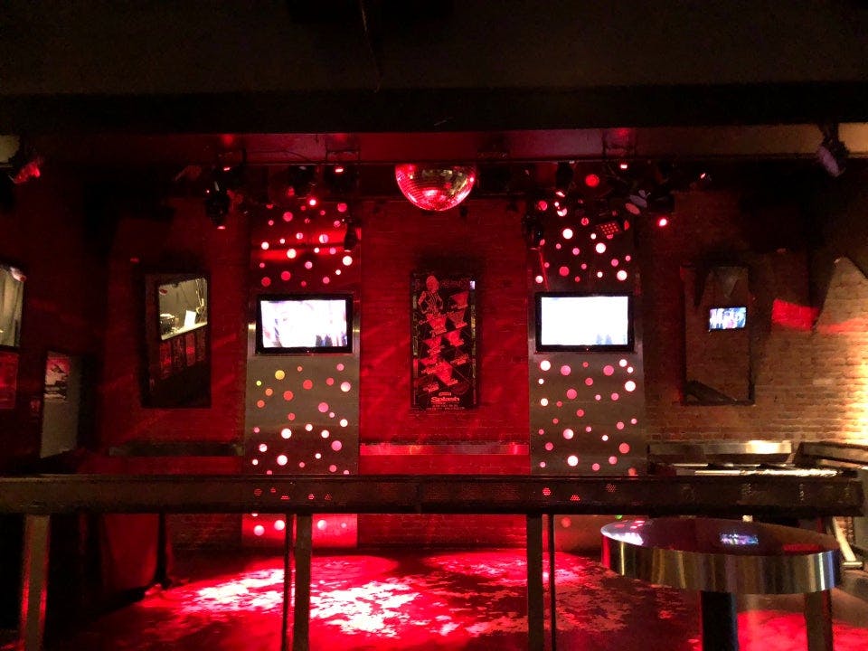 Vibrant dance floor with red lighting at Splash Bar San Jose for parties and events.