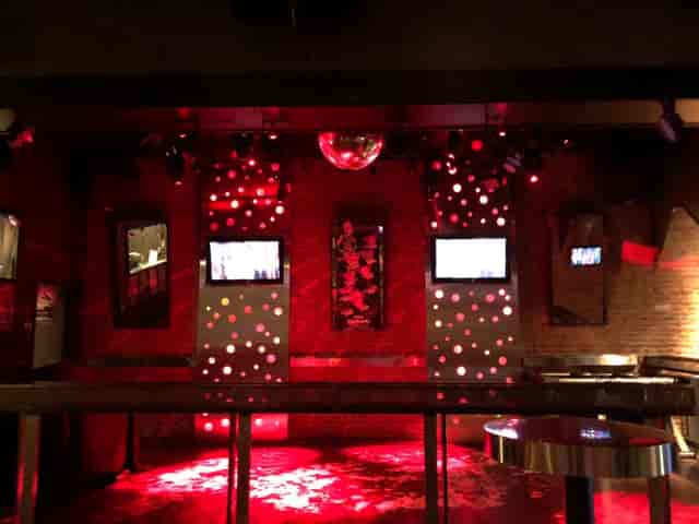 Vibrant dance floor with red lighting at Splash Bar San Jose for parties and events.