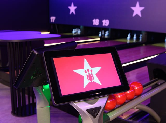 Modern Duckpin Lounge bowling alley with digital scoring, ideal for corporate events.