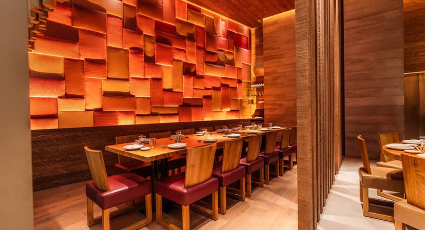 Semi-private dining room at Roka Riyadh, featuring a long wooden table for intimate events.