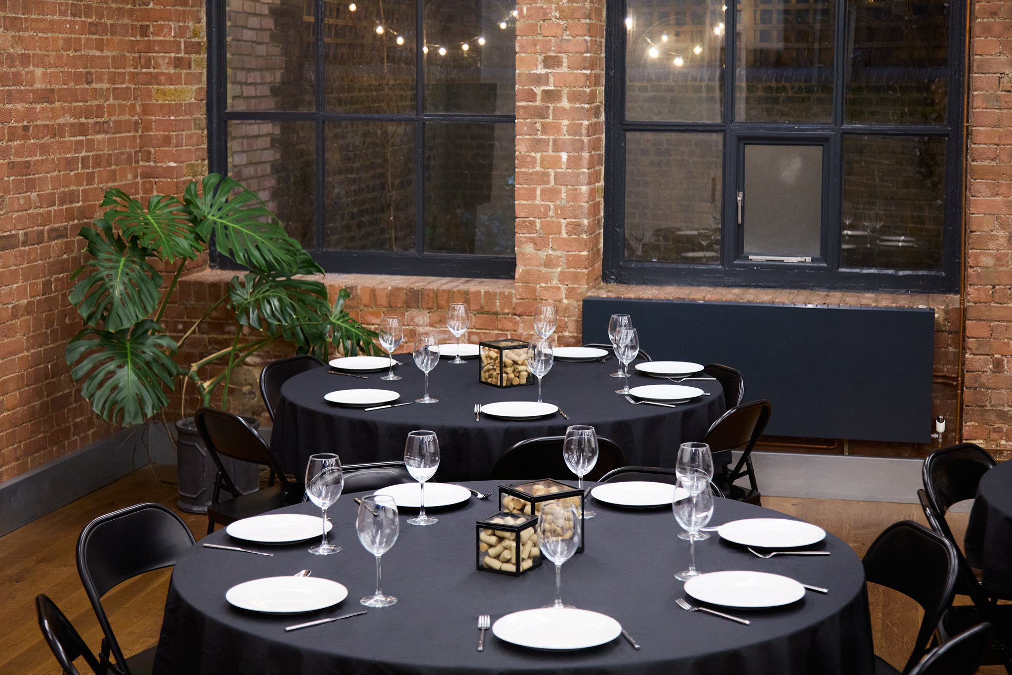 Elegant dining setup with round tables, ideal for corporate events and social gatherings. - Banner