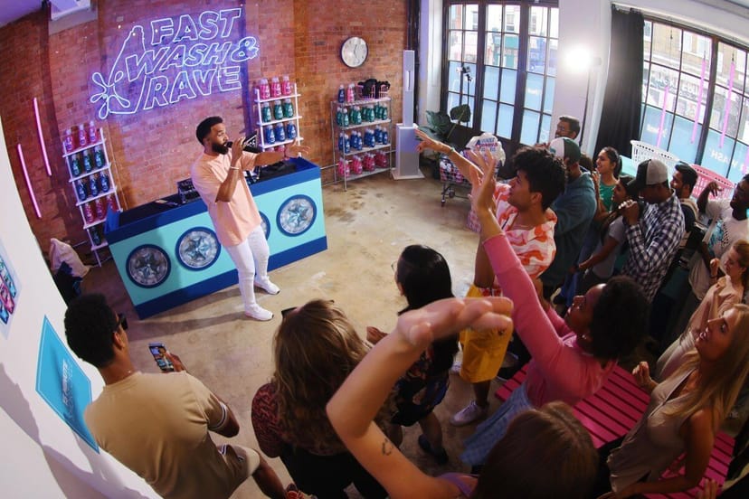 Vibrant event space with engaging host, showcasing experiential marketing in Kachette Annex.