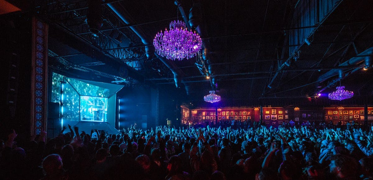 "Vibrant Fillmore Auditorium balcony with engaged audience and dynamic lighting for events."