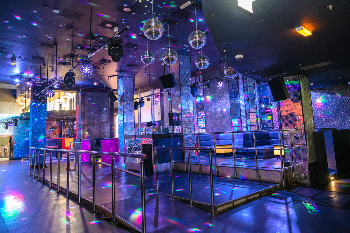 Vibrant Cargo Manchester event space with colorful lights, ideal for parties and corporate events. - Banner