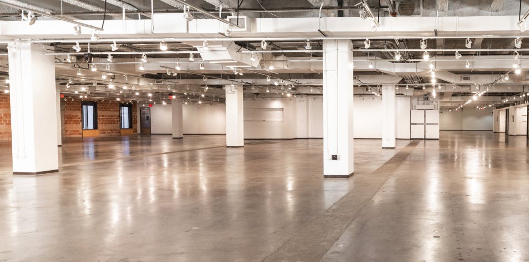 Spacious Fashion Industry Gallery lobby with polished concrete floors for events and exhibitions.