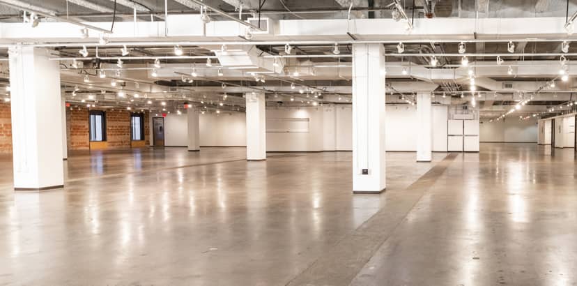 Spacious Fashion Industry Gallery lobby with polished concrete floors for events and exhibitions.