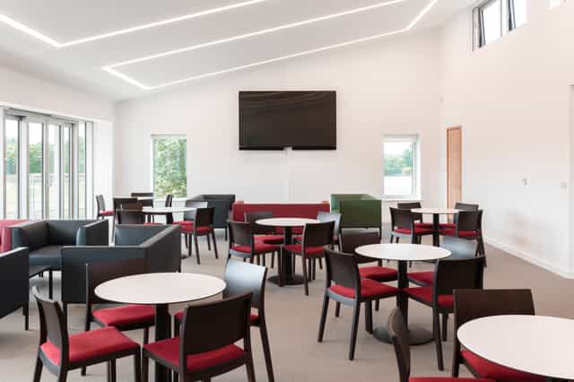 UCS New Pavilion Eve Lounge: modern meeting space with natural light for events and gatherings.