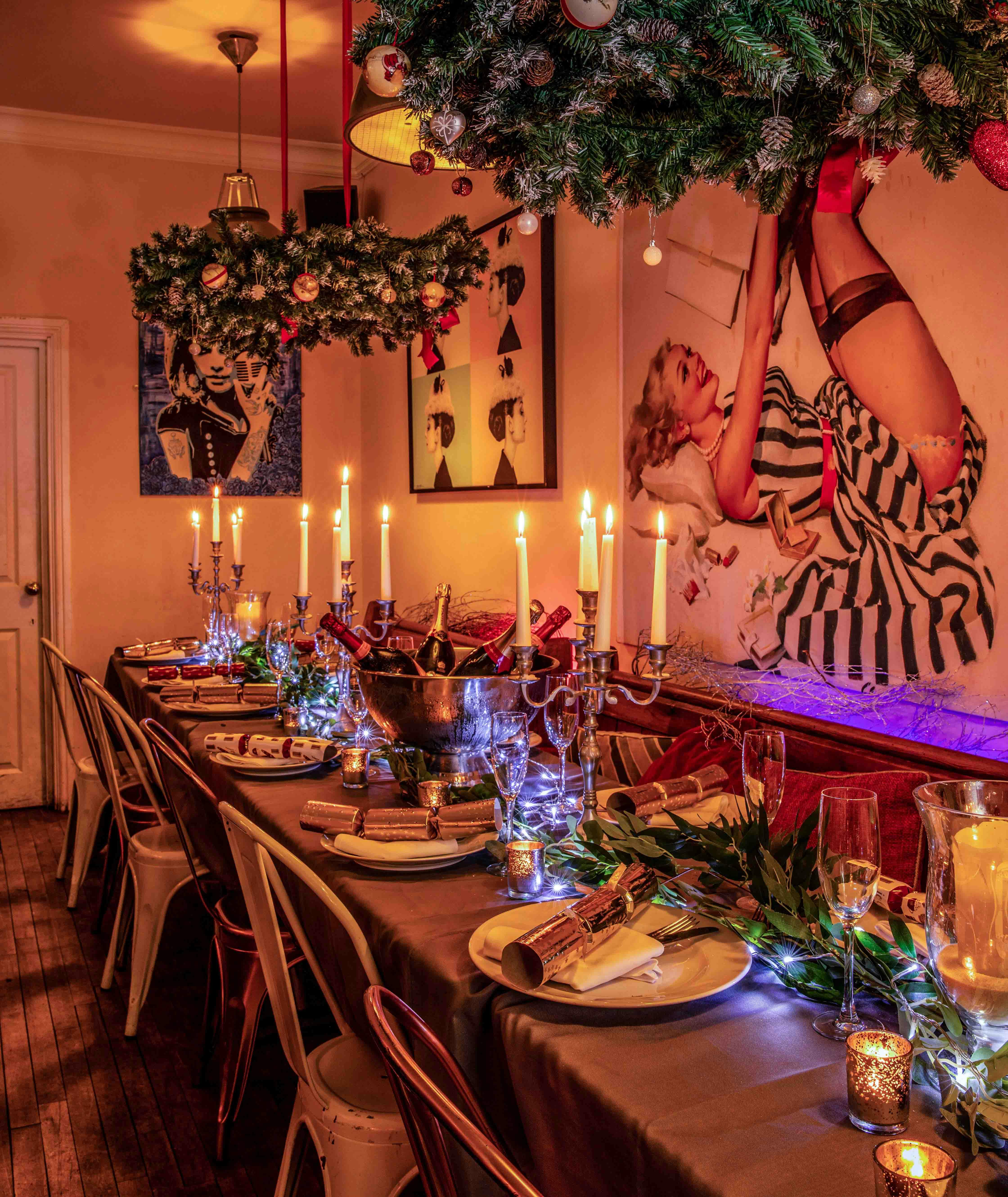 Elegant dining table with candlelight for intimate Christmas celebrations at The Little Blue Door.