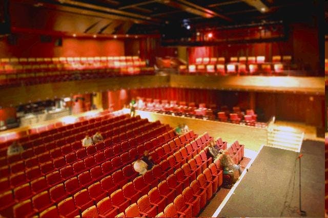 Bar Depot auditorium with tiered seating, perfect for events and workshops.
