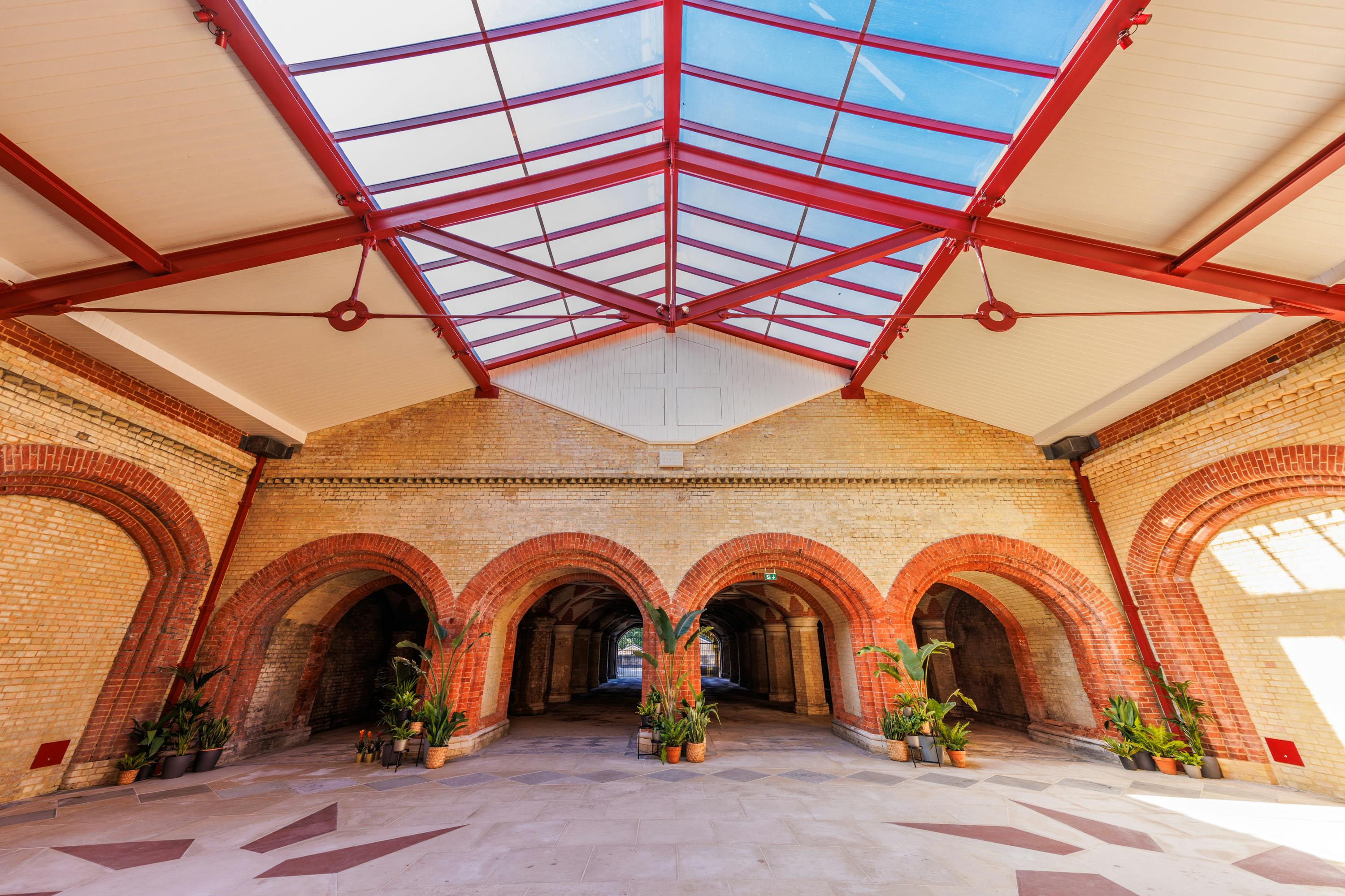 Spacious Subway venue with arched brickwork, ideal for networking events and exhibitions.