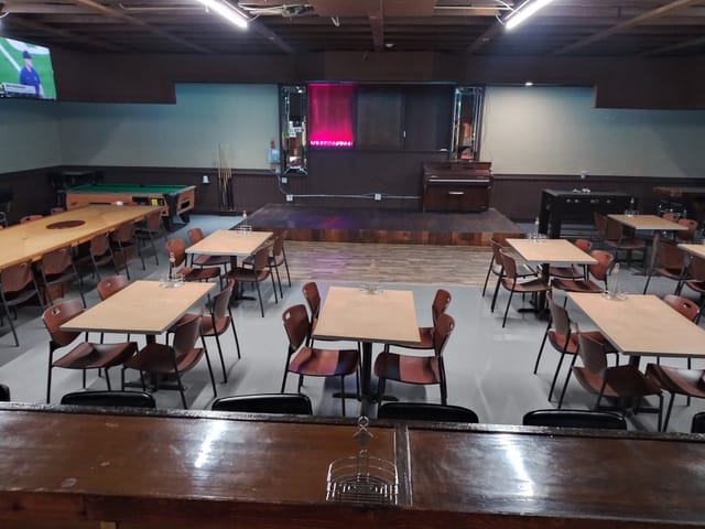 Grocery store event space with flexible seating for meetings and gatherings in Westside Live.
