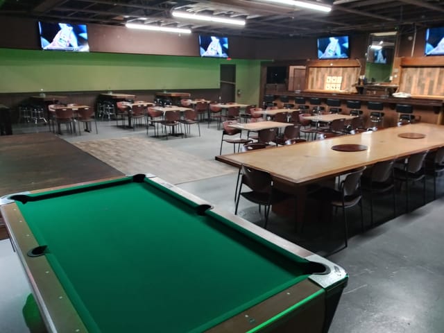 Grocery store event space with versatile seating for team-building and social gatherings.