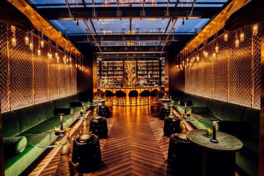 Stylish cocktail bar with warm lighting, perfect for upscale events and gatherings.