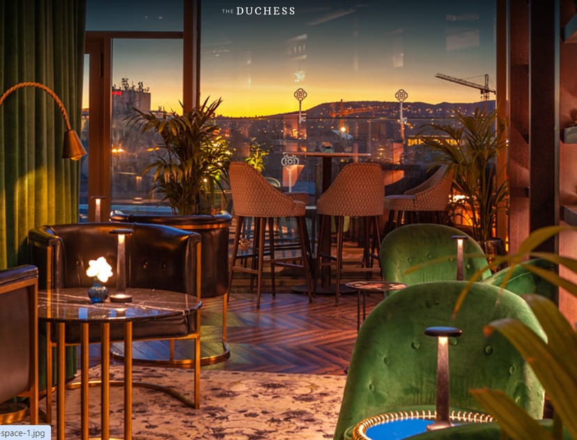 Stylish Duchess Rooftop event space with sunset view, perfect for networking and receptions.