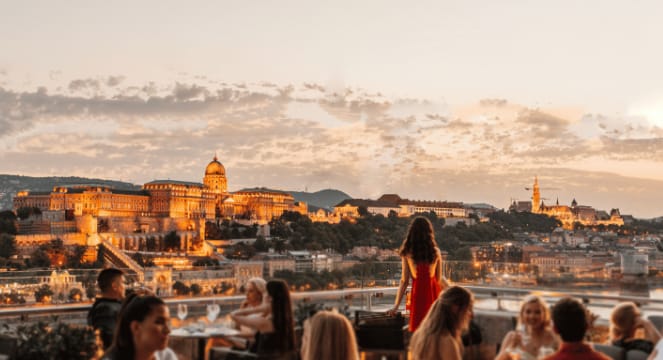 Stunning sunset over historic city at Half Terrace, perfect for upscale events and gatherings.