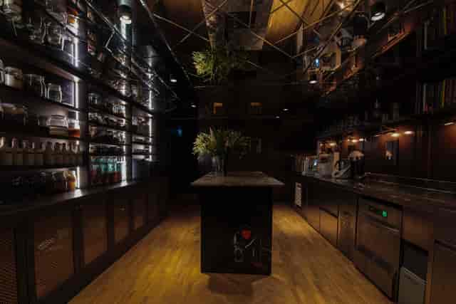 Modern bar venue with stylish lighting, perfect for cocktail receptions and social gatherings.