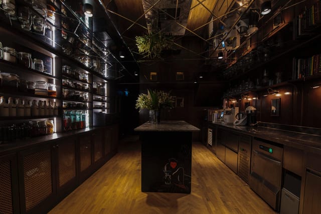 Modern bar venue with stylish lighting, perfect for cocktail receptions and social gatherings.