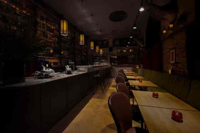 Stylish Black Swan Bar venue with sleek bar, ideal for gatherings and networking events.