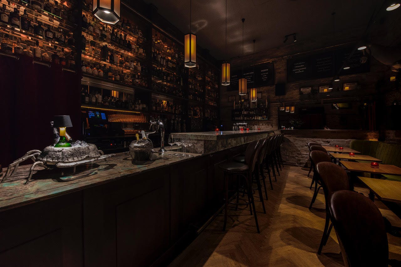 Stylish Black Swan Bar venue with warm lighting, perfect for networking events and cocktail receptions.