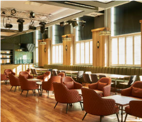 Stylish event space at Freddie's Bar with modern decor, ideal for networking and meetings. - Banner