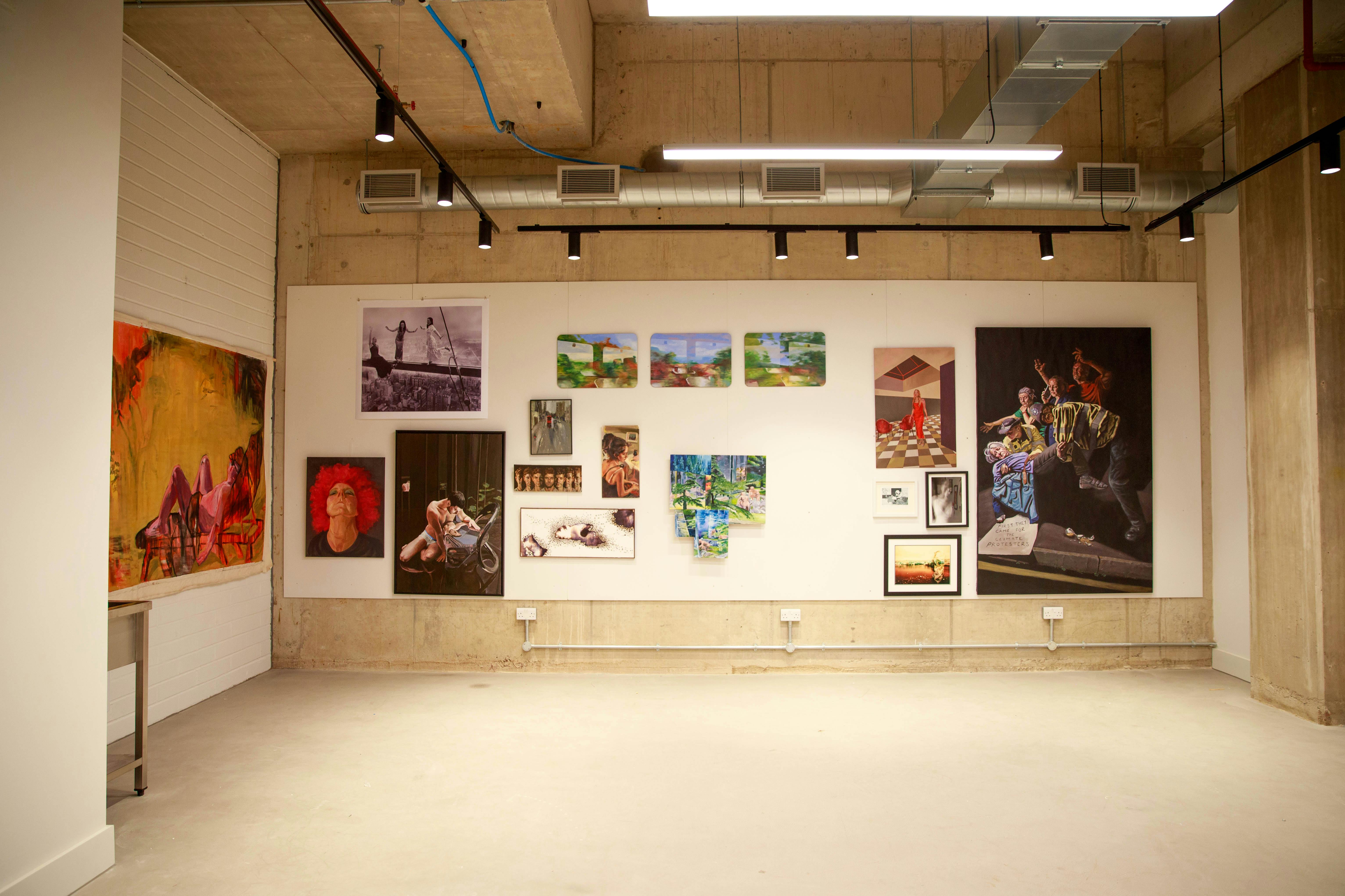 Versatile event space with art wall, perfect for meetings and workshops at The Art Academy.