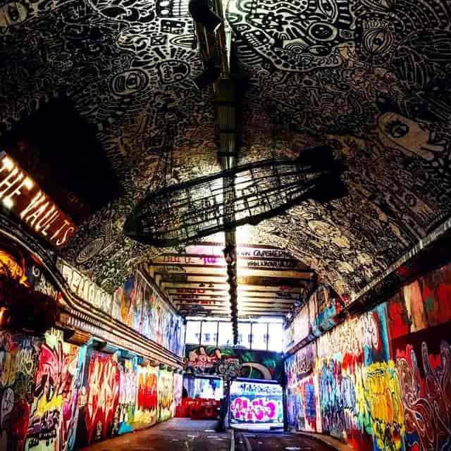 Vibrant graffiti-covered venue in The Vault for creative events and art exhibitions.