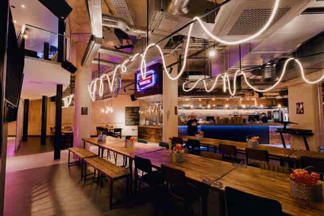 Modern basement event space with stylish lighting for networking and gatherings.
