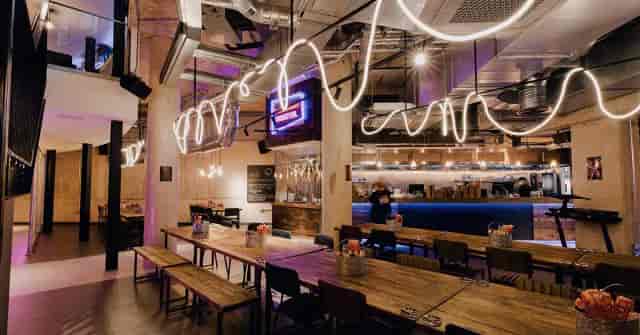 Modern event space in South Pavilion, featuring stylish lighting and spacious layout.