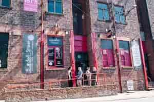 "FunnyBoyz Liverpool venue with rustic brick facade for corporate and social events."