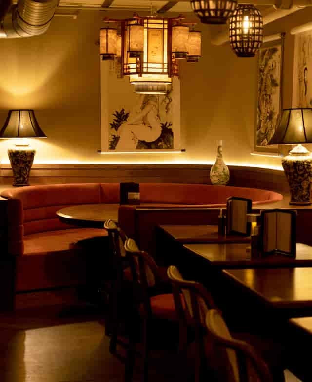 Intimate dining venue with warm lighting, ideal for private meetings and upscale events.