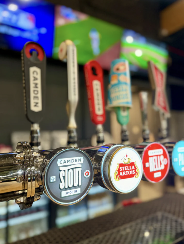Vibrant beer taps at The 108 for engaging parties and networking events. - Banner