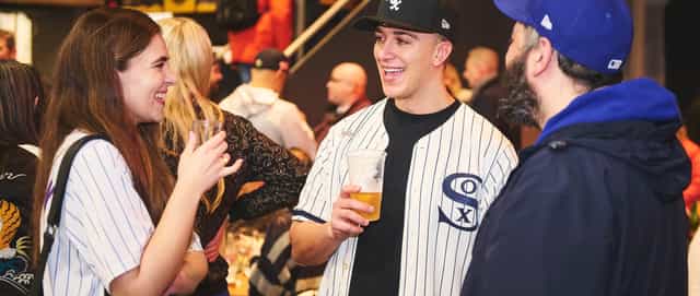 Lively sports-themed networking event with attendees in baseball jerseys.
