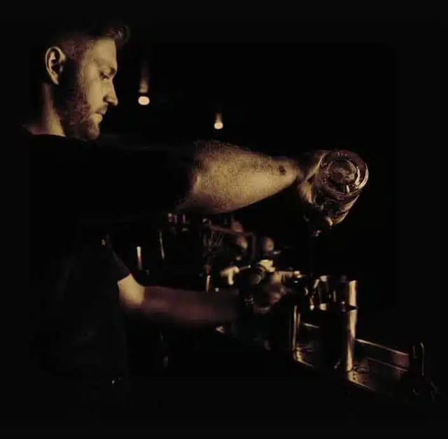 Bartender pouring a drink at Prohibition Lounge Bar, perfect for networking events.