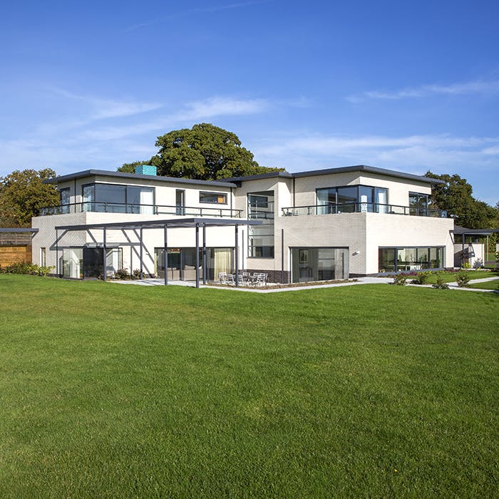 Modern Pavilion at Emsworth Polo Grounds for events, featuring sleek architecture and outdoor space.