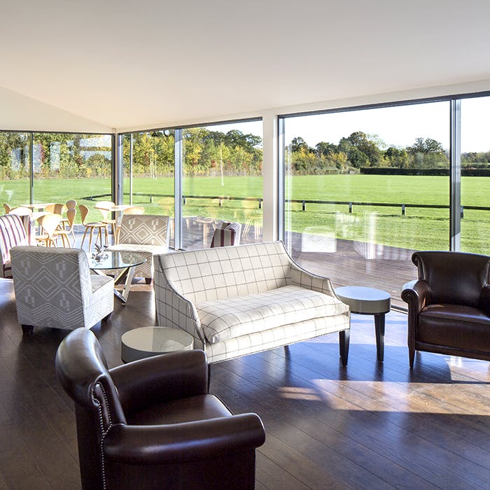 Stylish lounge area with natural light at Emsworth Polo Grounds for networking events.