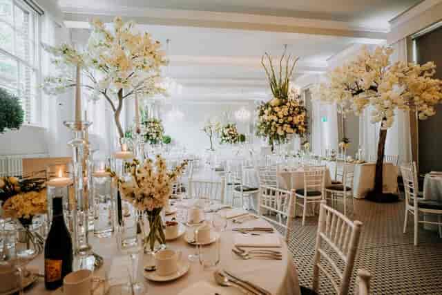 Elegant wedding venue with floral decor at Hawkstone Hall & Gardens.