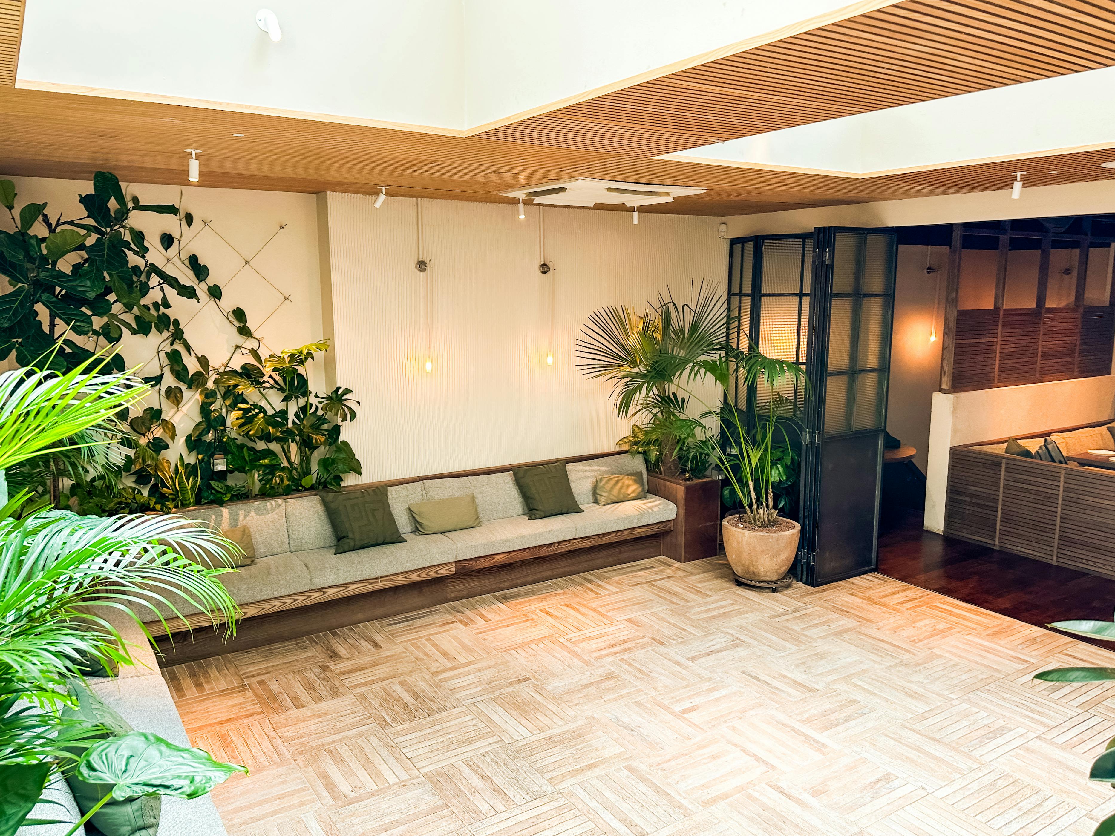 Versatile event space in Carmel Fitzrovia with lush greenery for networking and workshops.