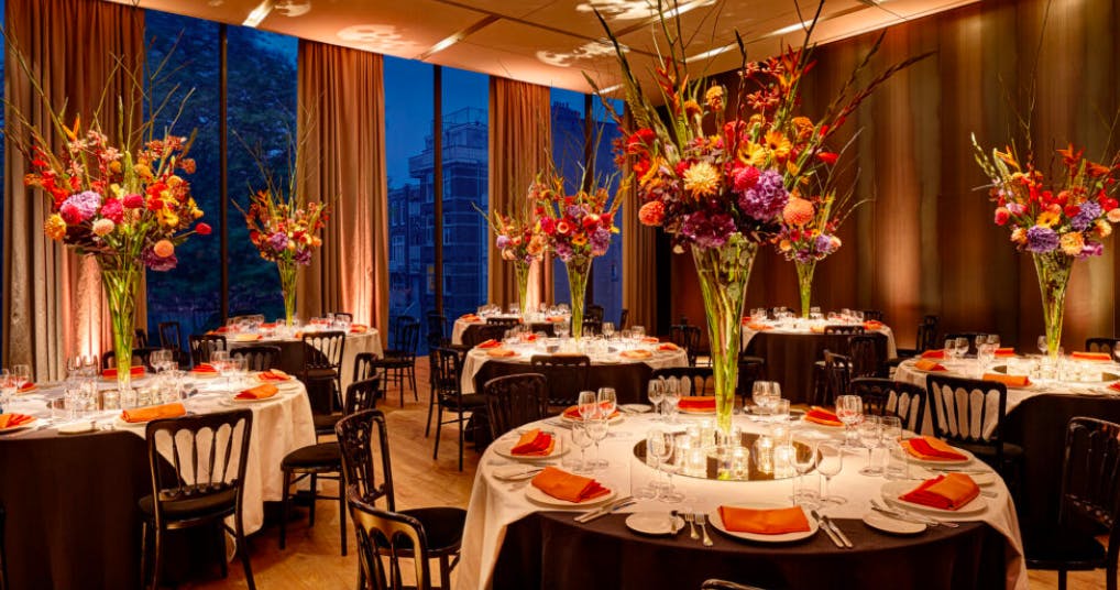 Elegant Symphony Room with round tables, perfect for gala events and formal dinners.