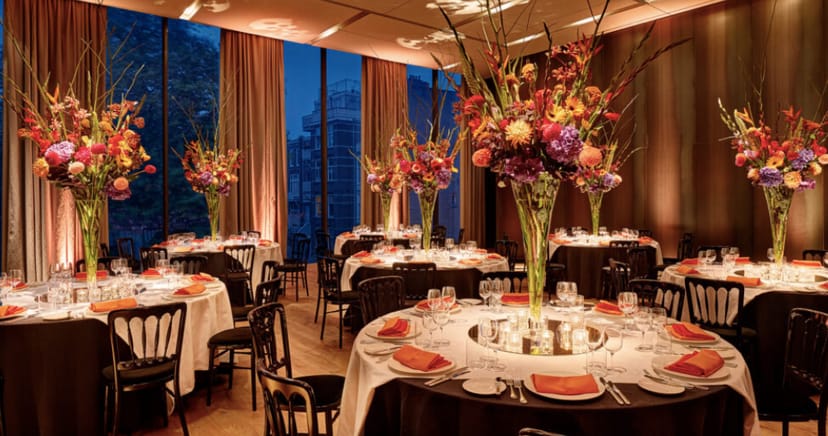 Elegant Symphony Room with round tables, perfect for gala events and formal dinners.