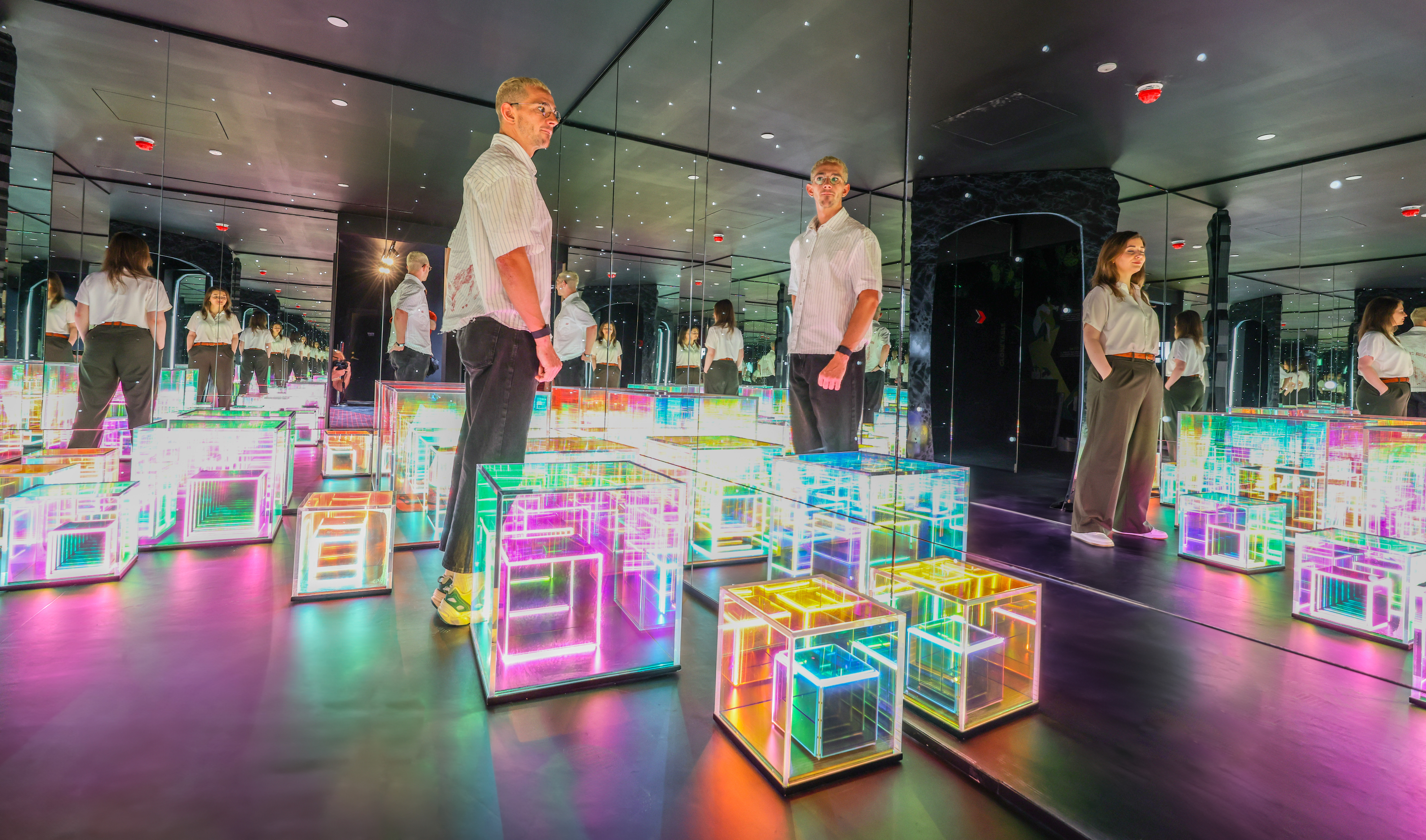 Modern immersive event space with illuminated cubes at Paradox Museum London. - Banner
