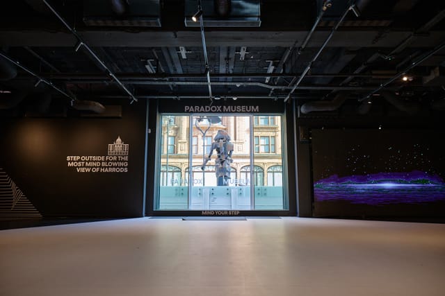 Modern event space in Paradox Museum London with large window, ideal for corporate meetings.
