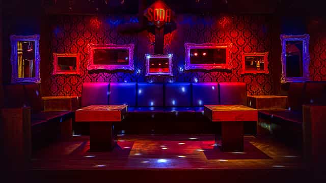 Vibrant Club Soda 23 lounge with plush seating, ideal for events and parties.