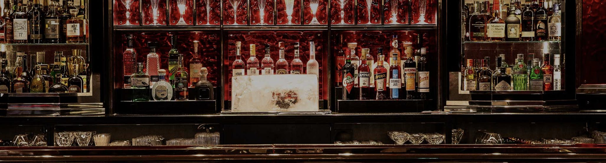 Elegant BACCARAT BAR at Harrods, showcasing premium spirits for upscale cocktail events.