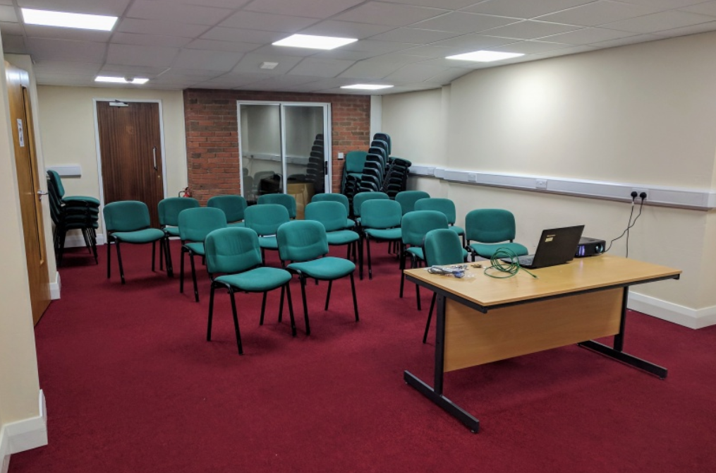 Lozells Community Centre meeting room with green chairs for workshops and presentations.