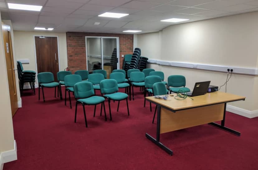 Lozells Community Centre meeting room with green chairs for workshops and presentations.