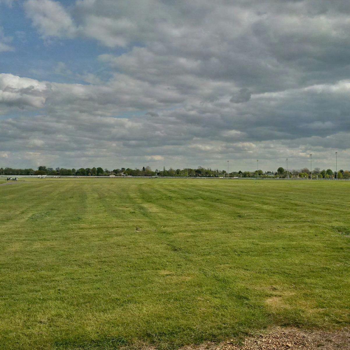 Kempton Park Racecourse grassy field, ideal for outdoor events and gatherings.