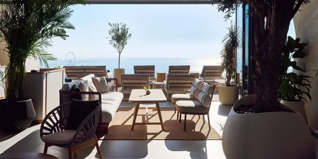 Stylish indoor lounge with ocean view, perfect for networking events and meetings.