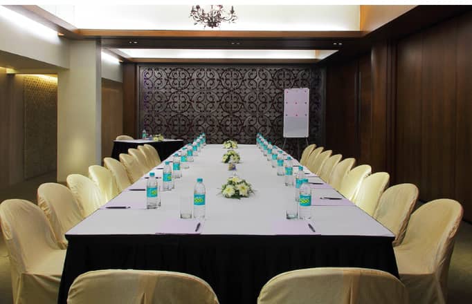 Crimson meeting room at The Mirador Hotel Mumbai, elegantly set for professional gatherings.